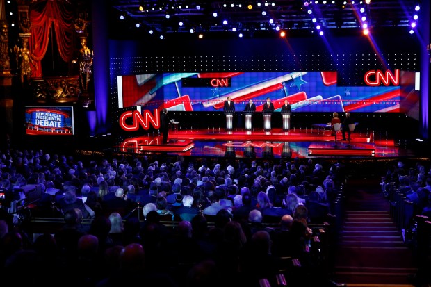 The candidates for the first debate, Governor George Pataki, Mike Huckabee, Rick Santorum and Lindsey Graham take the stage for the CNN Republican Debate in Las Vegas, Nevada at the Venetian Theater in the Venetian Hotel.